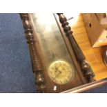 A mahogany Vienna wall clock.