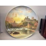 A large painted Wedgwood plate depicting Richmond castle, Yorkshire.