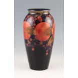 A Moorcroft pottery vase with Pomegranate pattern on blue ground, shape number 393, bears