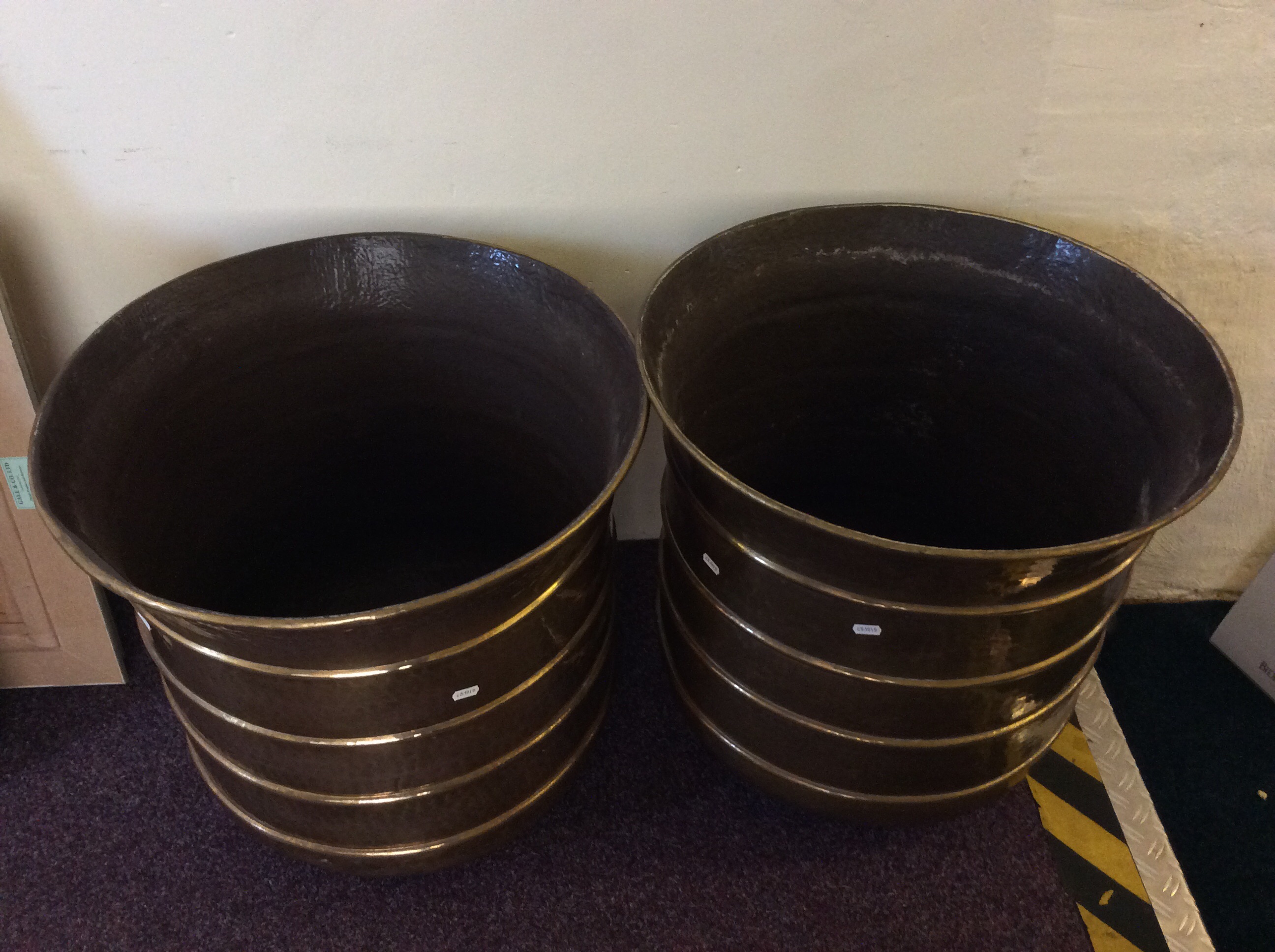 Two large brass pots.