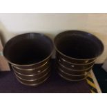 Two large brass pots.