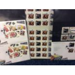 A sheet of Beatles stamps and 1st day covers.