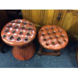 Two red leather stools.