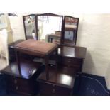A set of stag furniture including a bedroom desk with triple mirror and five drawers along with a