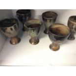 Five glazed ceramic Robert Fournier goblets.