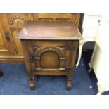 An oak bedside cabinet with Classical style door.