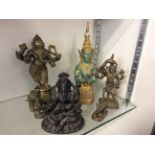 Six cast metal figurines of Hindu gods, including Ganesh.