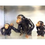 Three glazed porcelain Sylvac chimpanzees.