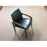 Two retro Danish teak and black leather arm chairs.