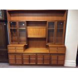 A suite of retro teak Nathan furniture to include large wall unit and another wall unit with