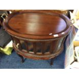 A reproduction mahogany drinks cabinet with lift off tray and glass inserts.