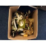 A box of assorted items including a set of mirror decorations, a deer wall hanging, a Tun 1917 toy