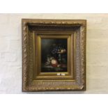 A pair of gilt framed still life oil on boards.