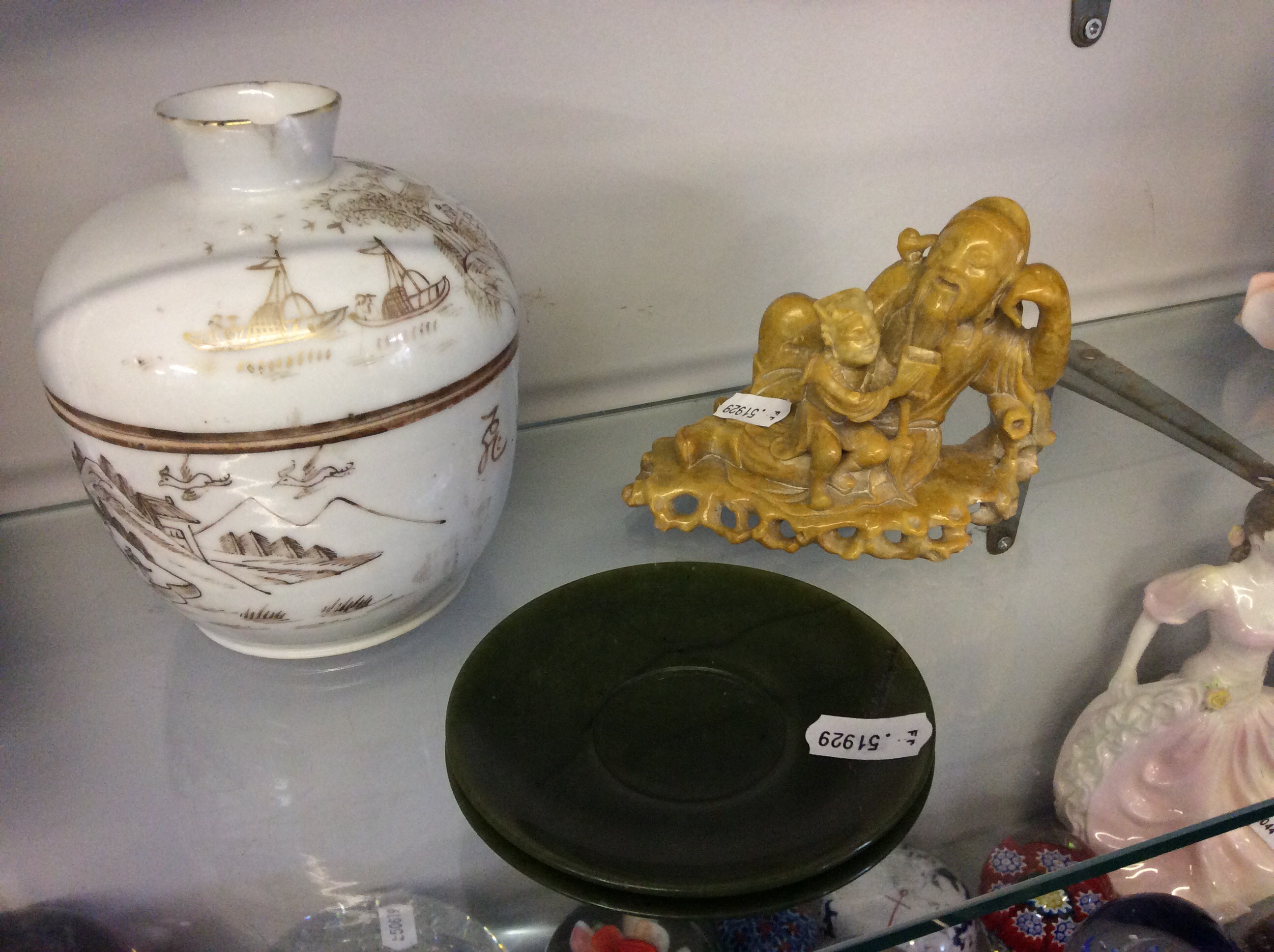 Two jade saucers, a soapstone figure and Chinese lidded pot.