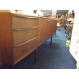 A reto teak McIntosh sideboard with drawer and cupboard compartments together with a McIntosh