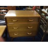 A retro teak G Plan chest of drawers together with a Danish teak framed mirror.