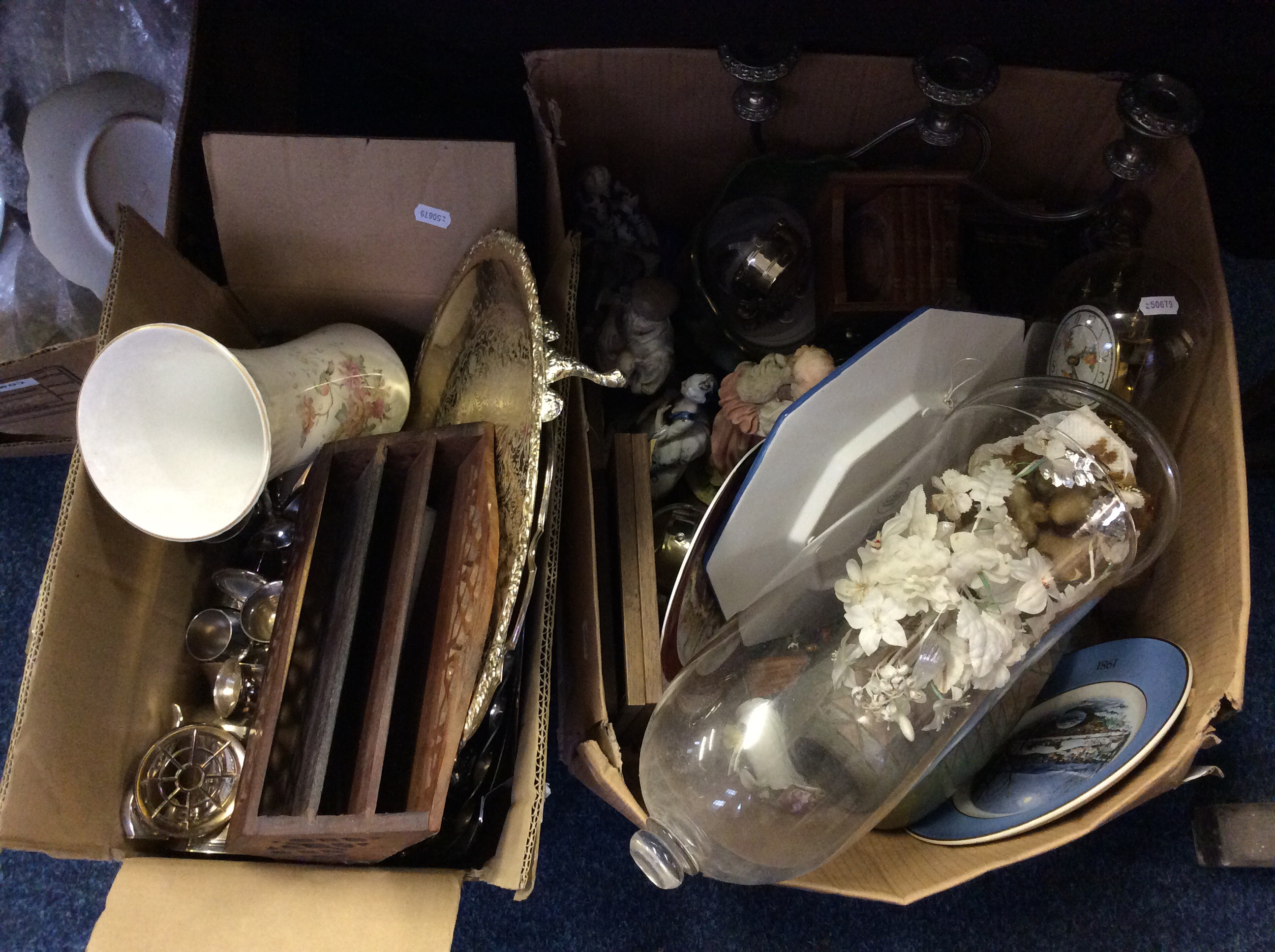 Two boxes of assorted items including wooden writing box, metal cups, a candlestick and a display