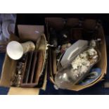 Two boxes of assorted items including wooden writing box, metal cups, a candlestick and a display