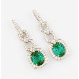 A pair of green tourmaline and diamond stud drop earrings, each set with a green tourmaline,