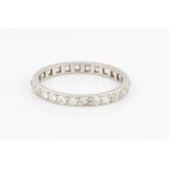 A diamond full hoop eternity ring, set with old cut diamonds, set in unmarked white metal, ring size