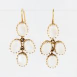 A pair of 9ct yellow gold moonstone drop earrings, each set with four moonstone cabochons, with