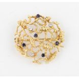 A 1960s 18ct yellow gold sapphire and diamond brooch, of organic open metalwork design and set