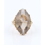 A 9ct yellow gold smoky quartz dress ring, set with a marquise cut smoky quartz measuring approx.