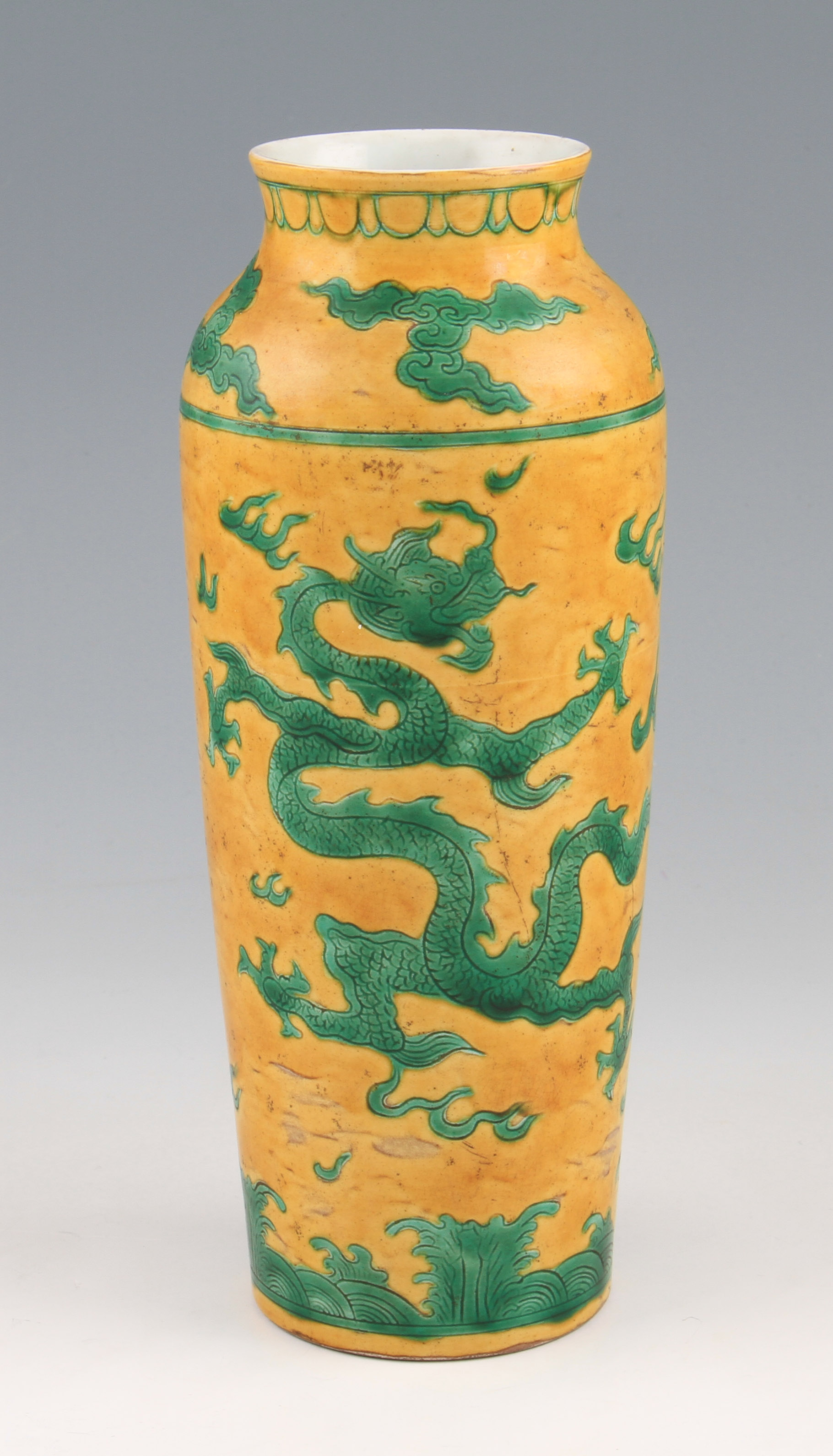 A late 19th Century Chinese Guangxu period pottery vase of tapered shouldered form having green