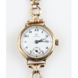 A 9ct yellow gold Omega ladies wrist watch, the white dial having hourly Arabic numerals with minute