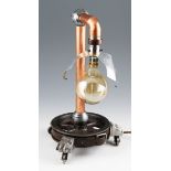 PETER MORRISON, table lamp constructed from reclaimed materials, including copper pipes, wheel and