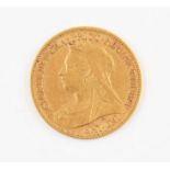 A Victoria 1890 gold half sovereign coin.