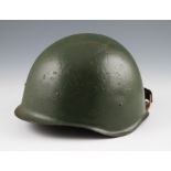 A 1940’s Russian helmet in green with liner, together with a WW2 Czech helmet with liner dated