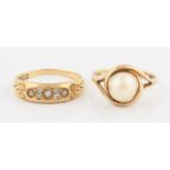 An 18ct yellow gold pearl and diamond ring, set with three half pearls interspersed with old cut