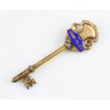 A silver gilt and enamel key, engraved 'The C.G.H.S. Co. Ltd. Sept 27th 1911 Grand Palace',