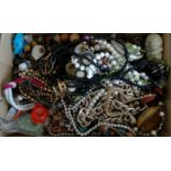 A quantity of costume jewellery to include beads, bangles, rings, chains etc.