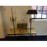 An onyx topped coffee table together with a metal magasine rack and two brass floor standing