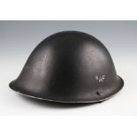 A group of three post war 1944 pattern helmets, one in black with later ‘8AF’ decal, dated 1952,