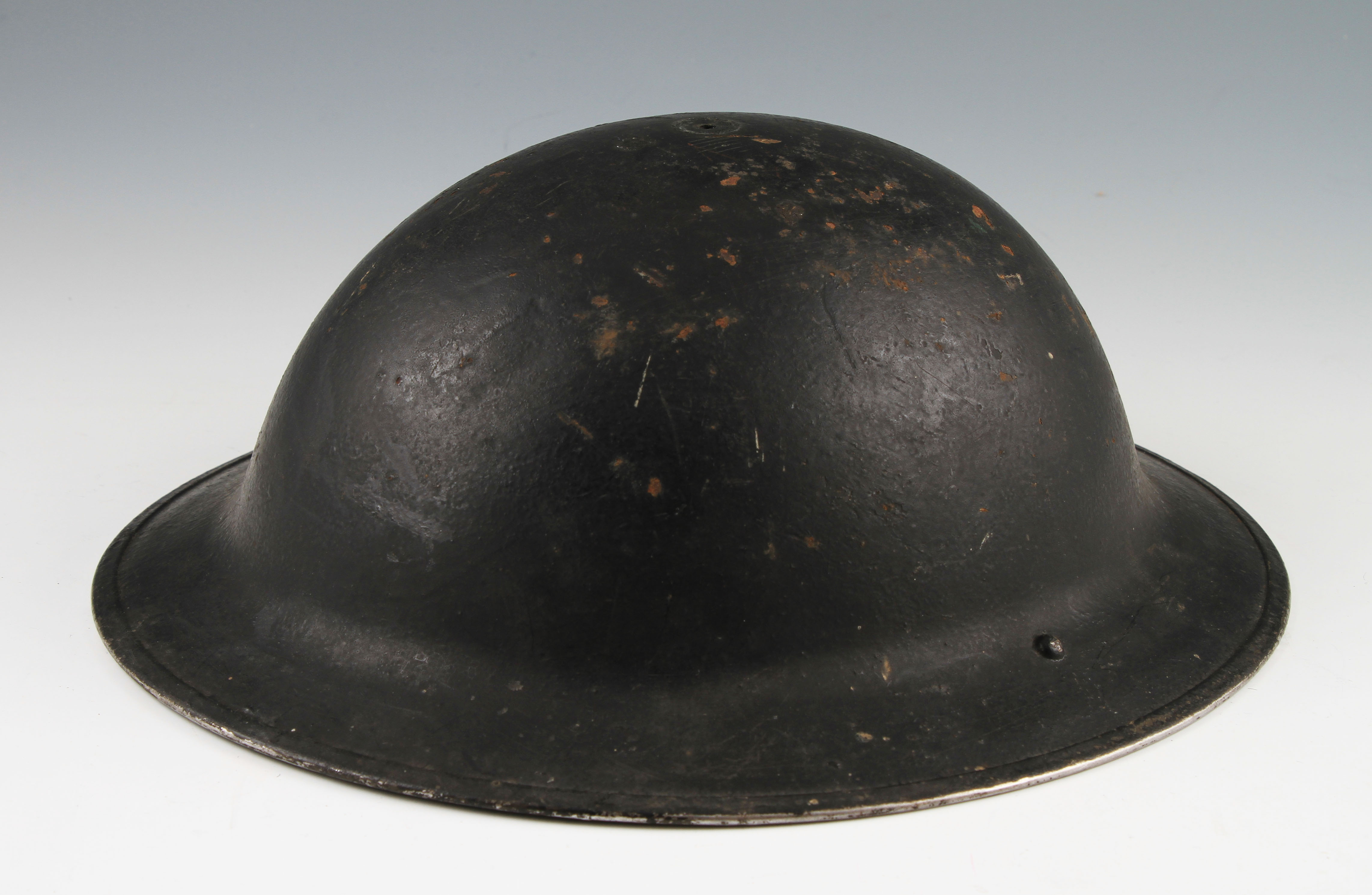 A WW2 black St John's ambulance black helmet, dated 1940, no liner.