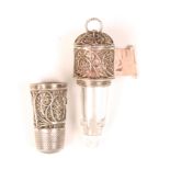 A good early 19th Century silver filigree combination thimble/scent bottle/tape measure, the thimble