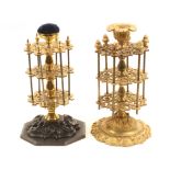 Two 19th Century reel stands comprising a brass example with three pierced circular tiers and six