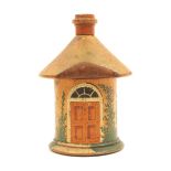 An early 19th Century painted Tunbridge ware nutmeg grater in the form of a circular cottage painted