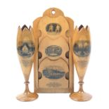 A pair of Mauchline ware spill vases and a letter rack, the tulip form spill vases in stripes of