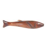 A mid 19th Century mahogany knitting stick in the form of a fish, with needle hole to mouth, 21cm.