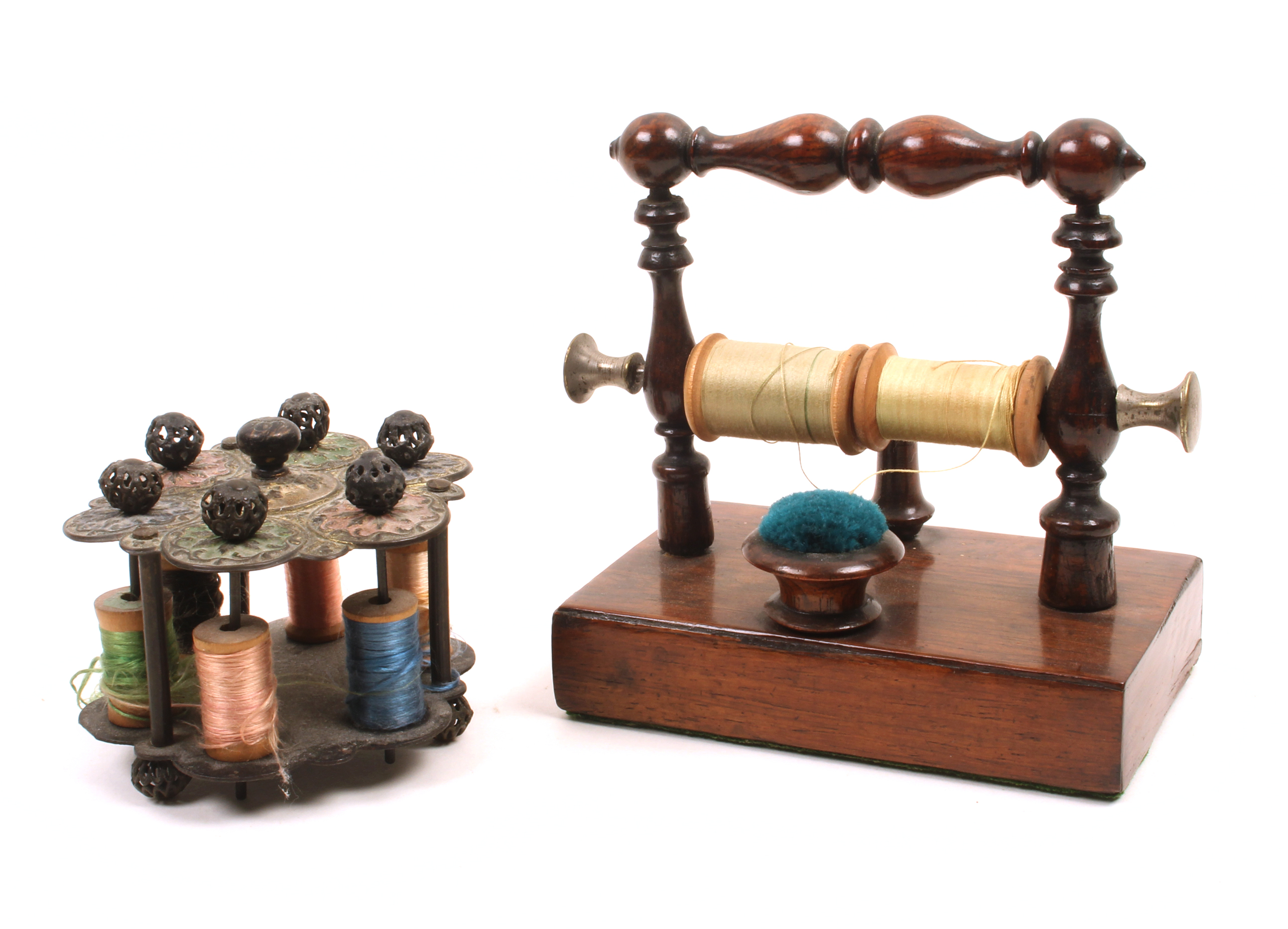 Two 19th Century reel stands comprising a rosewood example, the rectangular base with thimble