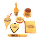 Mauchline ware – sewing seven pieces – comprising a bottle form thimble/reel case (HGO and Co.,