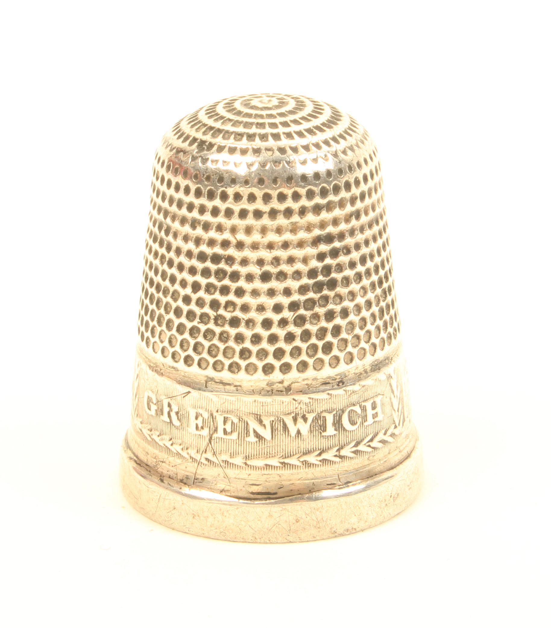 A rare early 19th Century silver souvenir thimble of Greenwich, the frieze depicting a view of the