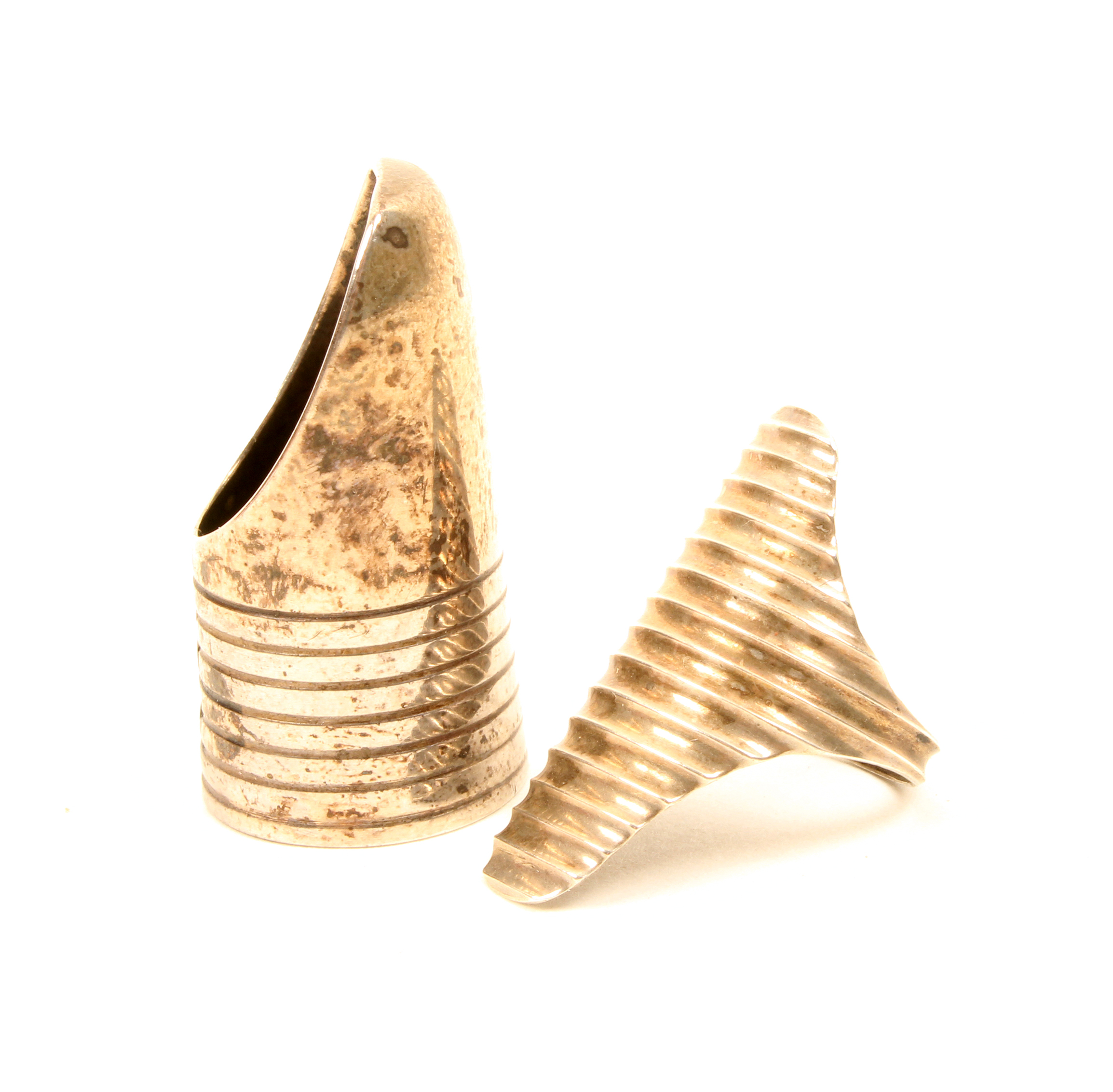 Two 19th Century silver finger guards, one of ring form with fluted face, probably Dutch, the