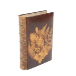 A Fern ware binding of Longfellow’s Poetical Works, leather spine, (silhouettes on brown ground), 17