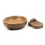 A ‘Mouseman’ Thompson oak bowl and an oak ash tray, the circular bowl with adzed exterior carved