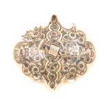 A Russian silver and niello belt buckle of shaped outline decorated with scrolls and script,